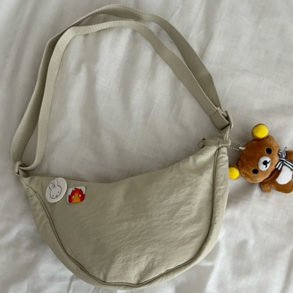 Uniqlo Beige Fortune Cookie Crescent Nylon Round Bag🥠